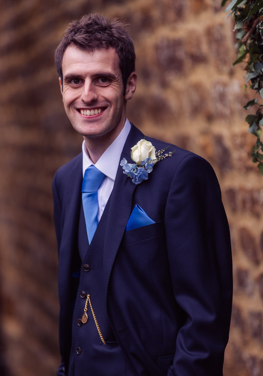 Groom before wedding in blue suit